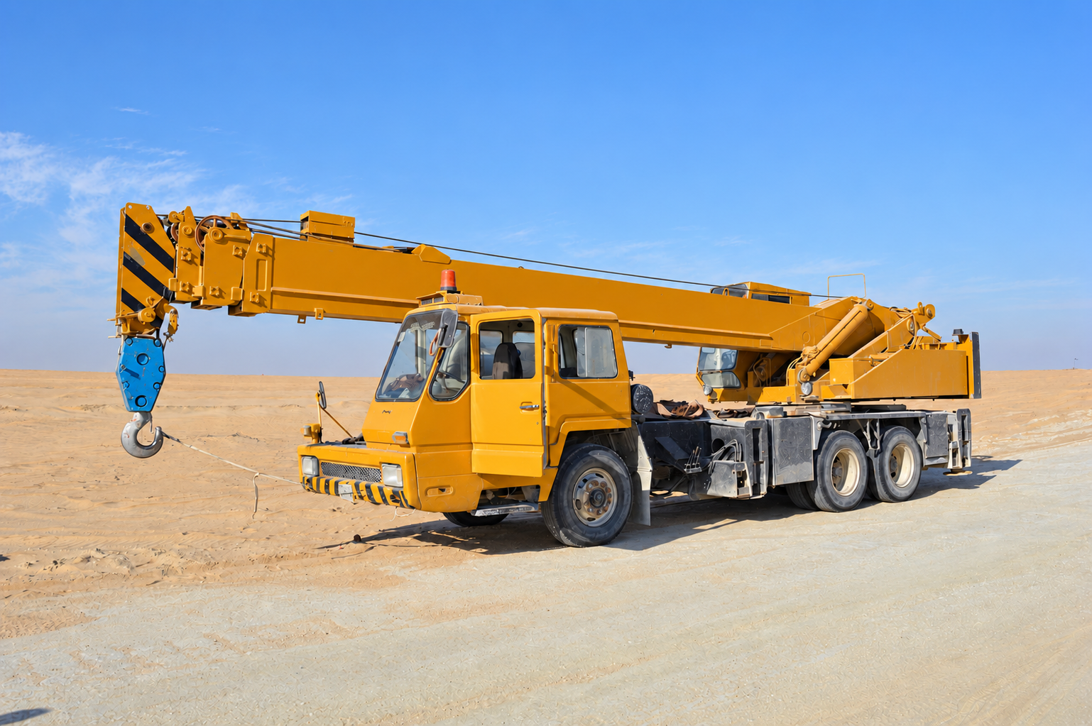 Yellow mobile crane on a job site